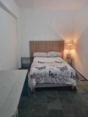 Quarto privativo para uma ou duas pessoas com banheiro compartilhado